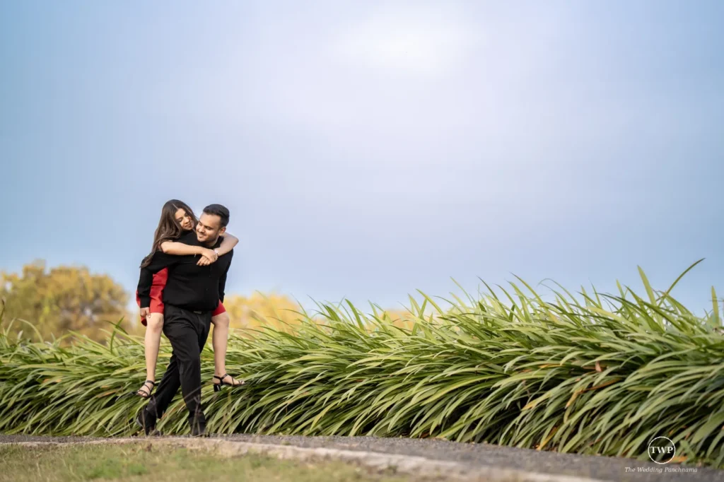 Couple sharing a playful piggyback moment during a post-wedding shoot near Indore