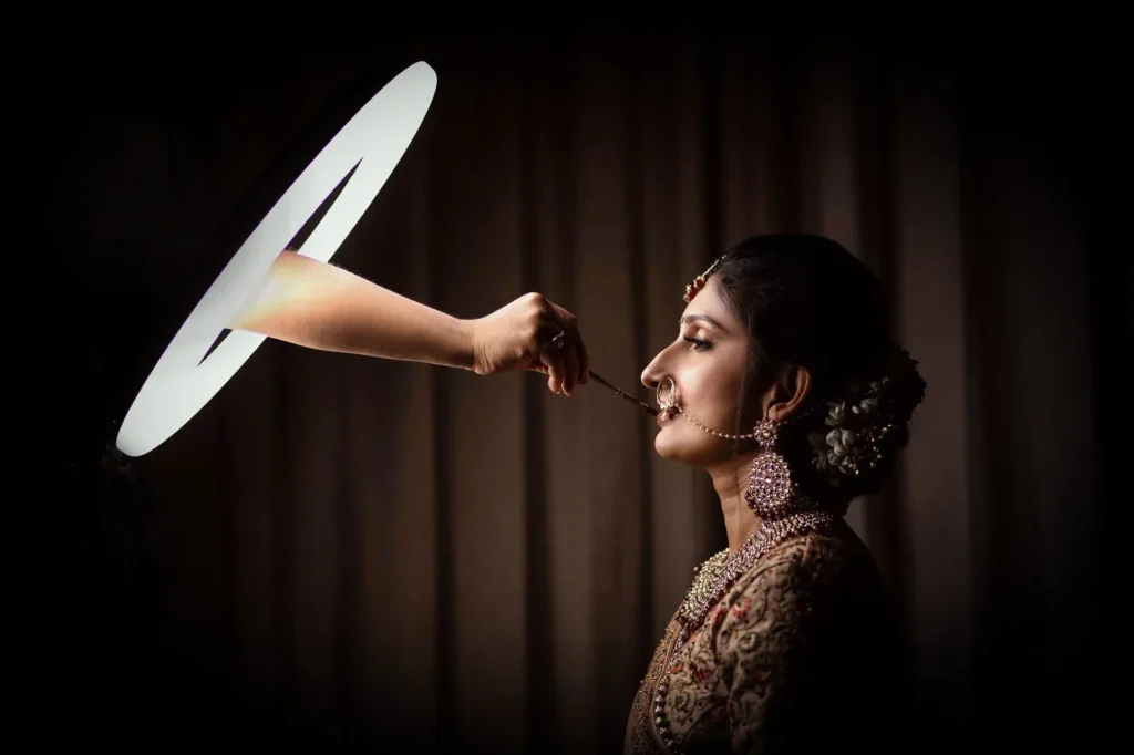 Indian bride in traditional jewellery and nath in soft studio light, bridal portrait photography in Indore